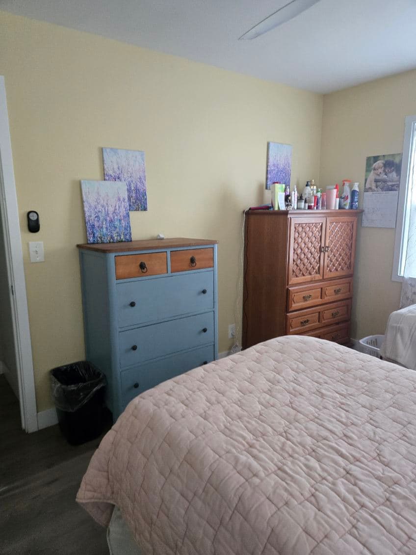Agape House 3 bedroom — dresser storage, artwork, and cozy furnishings