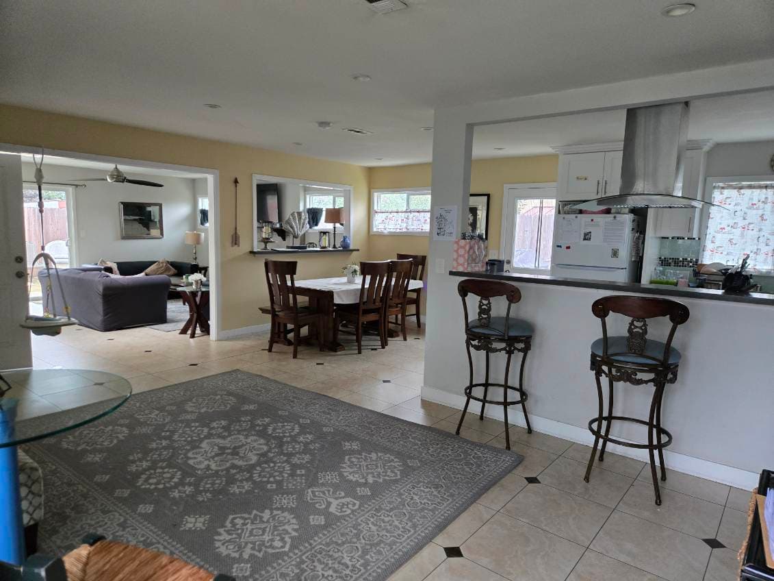 Agape House 3 open floor plan — dining area, living room, and kitchen