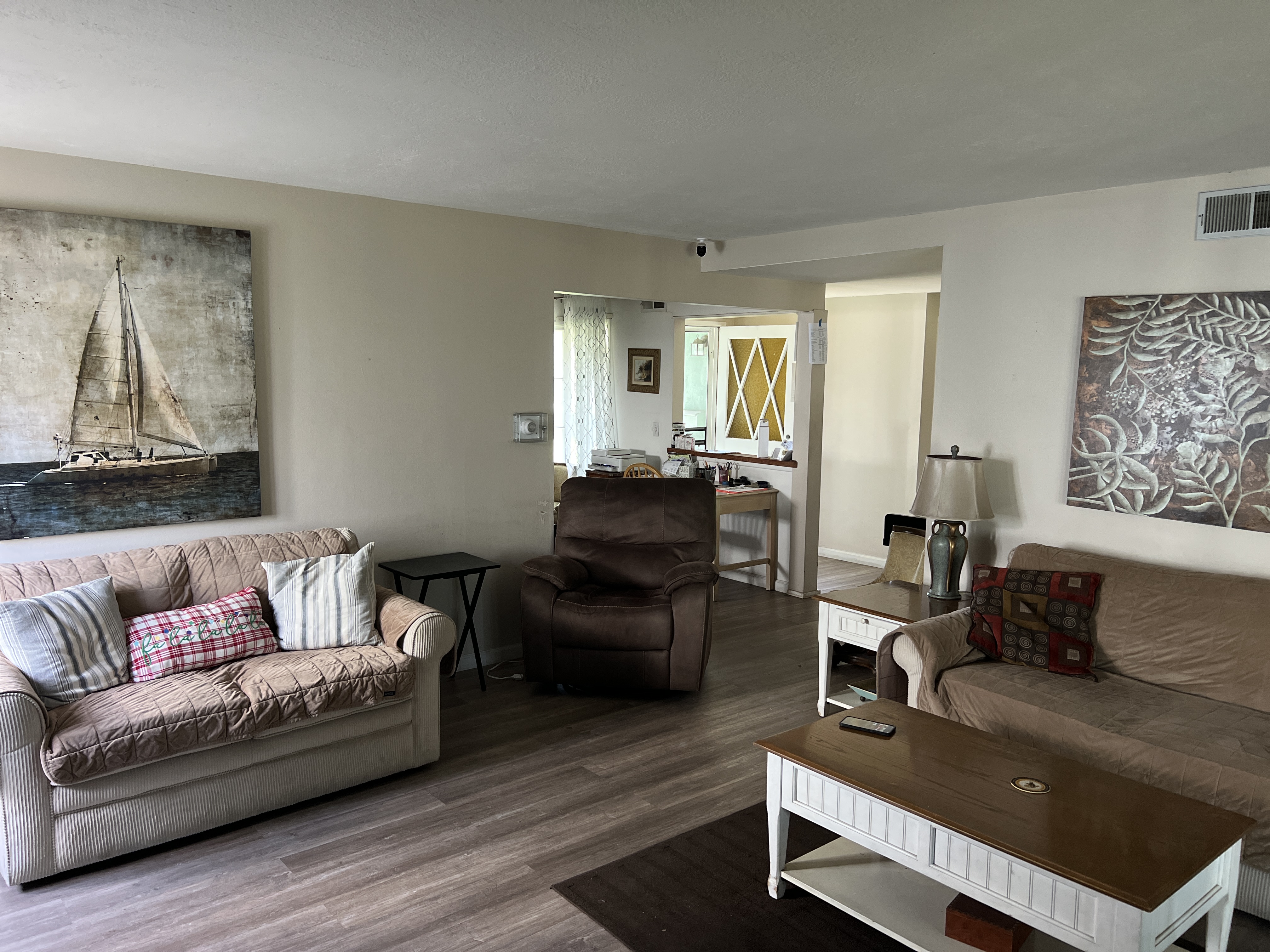 Living room seating area with artwork